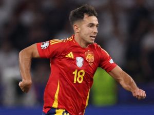 Spain's midfielder #18 Martin Zubimendi runs with the ball during the UEFA Euro 2024 final football match between Spain and England at the Olympiastadion in Berlin on July 14, 2024. (Photo by Adrian DENNIS / AFP)