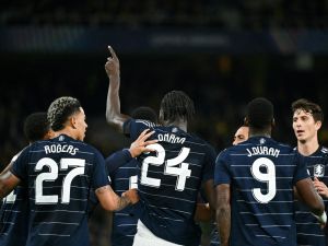 Aston Villa's Belgian midfielder #24 Amadou Onana celebrates with teammates after scoring his team's third goal during the UEFA Champions League 1st round day 1 football match between Young Boys and Aston Villa, at the Wankdorf Stadium in Bern, on September 17, 2024. (Photo by SEBASTIEN BOZON / AFP)