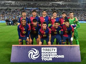 FC Barcelona players pose for a team photo before the start of a 2024 FC Series pre-season friendly football match between FC Barcelona and Manchester City at Camping World Stadium in Orlando, Florida, on July 30, 2024. (Photo by CHANDAN KHANNA / AFP)