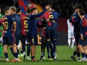 Barcelona's Spanish midfielder #06 Pablo Gavi hugs teammates at the end of the Spanish league football match between FC Barcelona and Sevilla FC at the Estadi Olimpic Lluis Companys in Barcelona on October 20, 2024. (Photo by Josep LAGO / AFP)