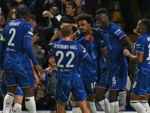 Chelsea's Portuguese midfielder #40 Renato Palma Veiga (C) celebrates with teammates after scoring the opening goal of the UEFA Conference League, league phase, football match between Chelsea and Gent at Stamford Bridge in London on October 3, 2024. (Photo by Glyn KIRK / AFP)