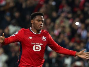 Lille's Canadian forward #09 Jonathan David celebrates scoring his team's first goal from the penalty spot during the UEFA Champions League football match between Lille LOSC and Real Madrid at the Pierre Mauroy Stadium in Villeneuve-d'Ascq, northern France, on October 2, 2024. (Photo by FRANCK FIFE / AFP)