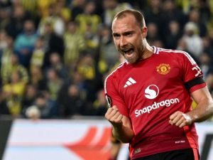 Manchester United's Danish midfielder #14 Christian Eriksen celebrates after scoring his team's first goal during the UEFA Europa League, 1st round day 3 football match between Fenerbahce SK and Manchester United at the Sukru Saracoglu Stadium in Istanbul on October 24, 2024. (Photo by Ozan KOSE / AFP)