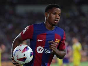 Barcelona's Spanish forward #10 Ansu Fati runs with the ball during the Spanish Liga football match between FC Barcelona and Cadiz CF at the Lluis Companys Olimpic Stadium in Barcelona on August 20, 2023. (Photo by LLUIS GENE / AFP)