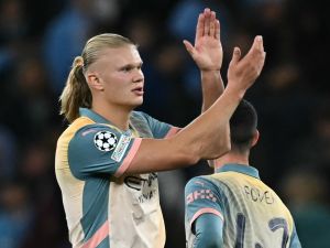 Manchester City's Norwegian striker #09 Erling Haaland applauds fans on the pitch after the UEFA Champions League, league phase football match between Manchester City and Inter Milan at the Etihad stadium, in Manchester, north-west England, on September 18, 2024 The game ended 0-0. (Photo by Paul ELLIS / AFP)