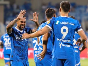 Hilal's Serbian forward #09 Aleksandar Mitrovic celebrates with his team after scoring his first goal during the Saudi Pro League football match between Al-Hilal and Al-Ittihad at the Prince Faisal bin Fahd Stadium in Riyadh on September 21, 2024. (Photo by Fayez NURELDINE / AFP)