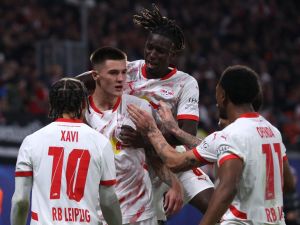RB Leipzig's Slovenian forward #30 Benjamin Sesko (2nd L) celebrates with teammates after scoring his team's second goal during the UEFA Champions League football match between RB Leipzig and Juventus FC at the Red Bull Arena in Leipzig on October 2, 2024. (Photo by Ronny HARTMANN / AFP)