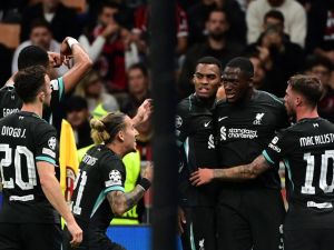 Liverpool's French defender #05 Ibrahima Konate (2nd R) celebrates with teammates after scoring his team's first goal during the UEFA Champions League 1st round day 1 football match between AC Milan and Liverpool FC at the San Siro stadium in Milan on September 17, 2024. (Photo by PIERO CRUCIATTI / AFP)