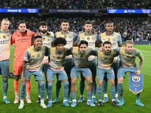 Manchester City players pose for a team photo ahead of the UEFA Champions League, league phase football match between Manchester City and Inter Milan at the Etihad stadium, in Manchester, north-west England, on September 18, 2024 (Photo by Oli SCARFF / AFP)