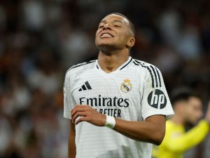 Real Madrid's French forward #09 Kylian Mbappe reacts during the Spanish league football match between Real Madrid CF and Villarreal CF at the Santiago Bernabeu stadium in Madrid on October 5, 2024. (Photo by OSCAR DEL POZO / AFP)