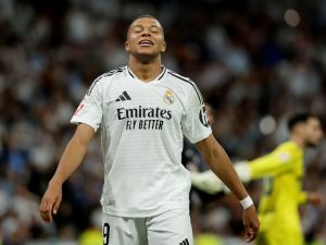 Real Madrid's French forward #09 Kylian Mbappe reacts during the Spanish league football match between Real Madrid CF and Villarreal CF at the Santiago Bernabeu stadium in Madrid on October 5, 2024. (Photo by OSCAR DEL POZO / AFP)