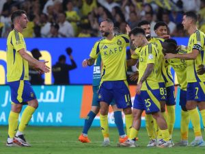 Nassr's Portuguese forward #07 Cristiano Ronaldo celebrates with teammates after their third goal in the Saudi Pro League football match between Al-Nassr and Al-Orobah at Al-Awwal Park in Riyadh on October 5, 2024. (Photo by Fayez NURELDINE / AFP)