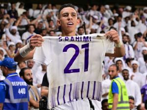 Ain's Moroccan midfielder #21 Soufiane Rahimi celebrates scoring his team's third goal during the second leg of the AFC Champions League Final between UAE's Al Ain and Japan's Yokohama F. Marinos at the Hazza Bin Zayed Stadium in Al-Ain on May 25, 2024. (Photo by Giuseppe CACACE / AFP)
