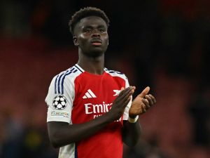 Arsenal's English midfielder #07 Bukayo Saka applauds the fans following during the UEFA Champions League football match between Arsenal and Paris Saint-Germain (PSG) at the Emirates Stadium in north London on October 1, 2024. Arsenal won the match 2-0. (Photo by Glyn KIRK / AFP)