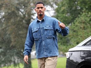 France's national football team's defender William Saliba gestures as he arrives to take part in the team's preparation for upcoming UEFA Nations League match qualifying matches in Clairefontaine-en-Yvelines on October 7, 2024. (Photo by FRANCK FIFE / AFP)