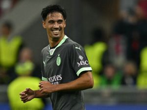 AC Milan's Dutch midfielder #14 Tijani Reijnders celebrates scoring his team's third goal during the Champions League football match between AC Milan and Club Brugge at the San Siro stadium in Milan on October 22, 2024. (Photo by Gabriel BOUYS / AFP)