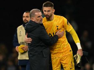 Tottenham Hotspur's Greek-Australian Head Coach Ange Postecoglou congratulates Tottenham Hotspur's Italian goalkeeper #01 Guglielmo Vicario after the UEFA Europa League League stage football match between Tottenham Hotspur and at the Tottenham Hotspur Stadium in London, on September 26, 2024. Tottenham won the match 3-0. (Photo by Glyn KIRK / AFP)
