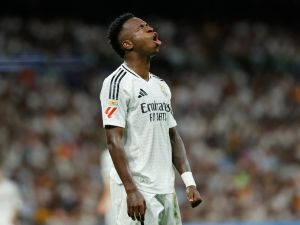 Real Madrid's Brazilian forward #07 Vinicius Junior reacts during the Spanish league football match between Real Madrid CF and Villarreal CF at the Santiago Bernabeu stadium in Madrid on October 5, 2024. (Photo by OSCAR DEL POZO / AFP)