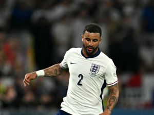 England's defender #02 Kyle Walker runs with the ball during the UEFA Euro 2024 semi-final football match between the Netherlands and England at the BVB Stadion in Dortmund on July 10, 2024. (Photo by OZAN KOSE / AFP)