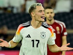 Germany's midfielder #17 Florian Wirtz celebrates after scoring the 3-0 goal during the League A Group A3 football match of the UEFA Nations League between Germany and Hungary in in Duesseldorf, western Germany, on September 7, 2024. (Photo by John MACDOUGALL / AFP)