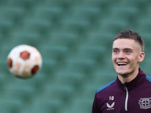 Bayer Leverkusen's German midfielder #10 Florian Wirtz eyes the ball as he takes part in a training session at the Dublin Arena stadium, in Dublin, on May 21, 2024, on the eve of their UEFA Europa League final football match against Atalanta. (Photo by Adrian DENNIS / AFP)