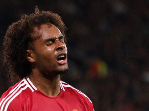 Manchester United's Dutch striker #11 Joshua Zirkzee reacts after missing a chance on goal during the UEFA Europa league stage football match between Manchester United and FC Twente at Old Trafford stadium in Manchester, north west England, on September 25, 2024. (Photo by Darren Staples / AFP)