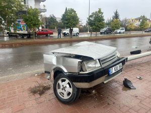 Car splits in half, topples streetlight in terrifying crash