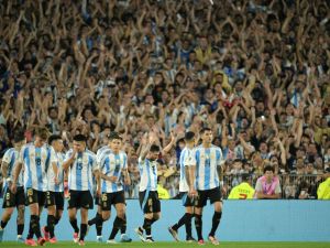 Argentina's forward #10 Lionel Messi celebrates with teammates after scoring a goal during the 2026 FIFA World Cup South American qualifiers football match between Argentina and Bolivia at the Mas Monumental stadium in Buenos Aires on October 15, 2024. (Photo by JUAN MABROMATA / AFP)
