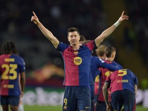 Barcelona's Polish forward #09 Robert Lewandowski celebrates scoring his team's third goal during the UEFA Champions League, league phase day 5 football match between FC Barcelona and Stade Brestois 29 (Brest) at the Estadi Olimpic Lluis Companys in Barcelona, on November 26, 2024. (Photo by MANAURE QUINTERO / AFP)