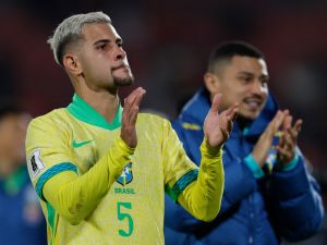 Brazil's midfielder Bruno Guimaraes celebrates after winning the 2026 FIFA World Cup South American qualifiers football match between Chile and Brazil, at the National stadium in Santiago, on October 10, 2024. (Photo by Javier TORRES / AFP)