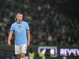 Manchester City's Norwegian striker #09 Erling Haaland reacts after failing to score from the penalty spot during the UEFA Champions League, league phase day 4 football match between Sporting Lisbon and Manchester City at the Jose Alvalade stadium in Lisbon on November 5, 2024. (Photo by PATRICIA DE MELO MOREIRA / AFP)
