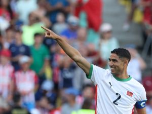 Morocco's defender #02 Achraf Hakimi celebrates scoring his team's sixth goal in the men's bronze medal football match between Egypt and Morocco during the Paris 2024 Olympic Games at the La Beaujoire Stadium in Nantes on August 8, 2024. (Photo by Alain JOCARD / AFP)