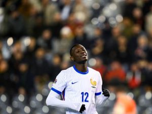 France's forward #12 Randal Kolo Muani reacts after missing a goal opportunity during the UEFA Nations League League A, Group A2 football match between Belgium and France, at the King Baudouin Stadium in Brussels, on October 14, 2024. (Photo by JOHN THYS / AFP)