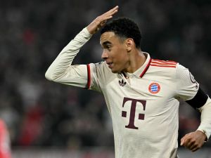 Bayern Munich's German midfielder #42 Jamal Musiala celebrates after scoring the 1-0 opening goal during the UEFA Champions League football match FC Bayern Munich vs SL Benfica in Munich, southern Germany, on November 6, 2024. (Photo by Tobias SCHWARZ / AFP)
