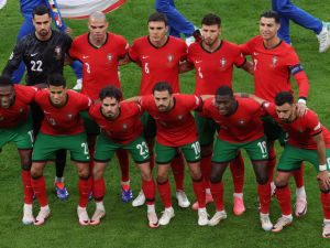 Portugal's players pose for a team picture before the start of the UEFA Euro 2024 quarter-final football match between Portugal and France at the Volksparkstadion in Hamburg on July 5, 2024. (Photo by Ronny HARTMANN / AFP)