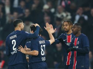 Paris Saint-Germain's French forward #10 Ousmane Dembele (R) celebrates after opening the scoring next to Paris Saint-Germain's French forward #29 Bradley Barcola during the French L1 football match between Paris Saint-Germain (PSG) and RC Lens (RCL) at The Parc des Princes Stadium in Paris on November 2, 2024. (Photo by FRANCK FIFE / AFP)