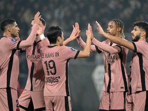 Paris Saint-Germain's French forward #29 Bradley Barcola (2-R) celebrates scoring his team's fourth goal with teammates during the French L1 football match between SCO Angers and Paris Saint-Germain (PSG) at The Raymond-Kopa Stadium in Angers, western France, on November 9, 2024. (Photo by Damien MEYER / AFP)