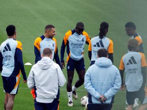Real Madrid's French forward #09 Kylian Mbappe (2L) talks with teammates during a training session at the club's training facilities of Valdebebas, in the outskirts of Madrid, on November 8, 2024, on the eve of their Spanish league football match against CA Osasuna. (Photo by OSCAR DEL POZO / AFP)