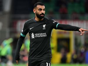 Liverpool's Egyptian forward #11 Mohamed Salah gestures during the UEFA Champions League 1st round day 1 football match between AC Milan and Liverpool FC at the San Siro stadium in Milan on September 17, 2024. (Photo by PIERO CRUCIATTI / AFP)