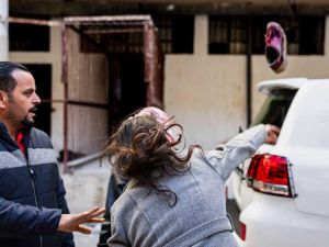 Syrian woman throws shoe at UN convoy near Saydnaya prison