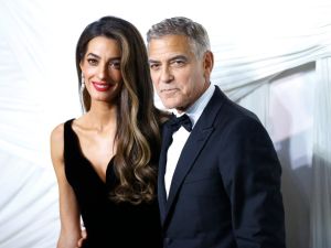US actor George Clooney (R) and his wife Lebanese-British barrister Amal Clooney arrive for "The Albies" hosted by the Clooney Foundation for Justice at the New York Public Library in New York, September 26, 2024. The Albies is the Clooney Foundation for Justice's annual event honoring courageous defenders of justice. The event is named in honor of Justice Albie Sachs, who is revered for his heroic commitment to ending apartheid. (Photo by John Lamparski / AFP) George Clooney and Amal Clooney
