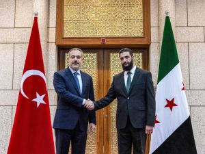 Hayat Tahrir al-Sham leader Ahmed al-Sharaa and Turkish FM Fidan
