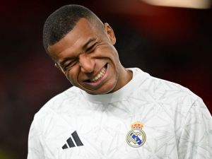 Real Madrid's French forward #09 Kylian Mbappe reacts during the warm up ahead of the UEFA Champions League football match between Liverpool and Real Madrid at Anfield in Liverpool, north west England on November 27, 2024. (Photo by Oli SCARFF / AFP)
