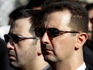 (FILES) A picture dated June 13, 2003 shows Syrian ex-President Bashar al-Assad and his brother Maher (L) attending their father's funeral in Damascus on June 13, 2000. (Photo by RAMZI HAIDAR / AFP) Maher Assad
