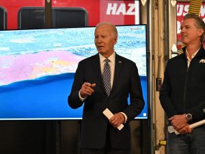 US President Joe Biden (L) with California Governor Gavin Newsom, speaks during a briefing from CalFire officials on the Palisades wildfire at Santa Monica Fire Station #5 in California on January 8, 2025. (Photo by ROBERTO SCHMIDT / AFP) California wildfires