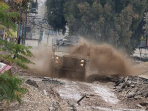  Israeli military vehicle deploys during a large-scale Israeli army raid in Jenin