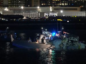 Emergency response units assess airplane wreckage in the Potomac River near Ronald Reagan Washington Airport on January 30, 2025 in Arlington, Virginia. An American Airlines flight from Wichita, Kansas collided with a helicopter while approaching Ronald Reagan National Airport. Andrew Harnik/Getty Images/AFP American airlines