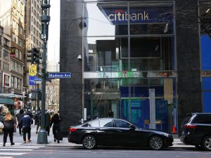 People walk past a Citibank on 42nd Street