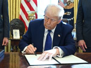 Former U.S. President Donald Trump has signed an executive order to downsize several federal agencies