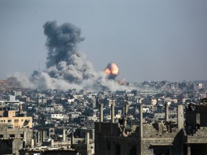 Ambushes kill Israeli soldiers as 80 Palestinians killed in Israeli assaults on Gaza aid zone